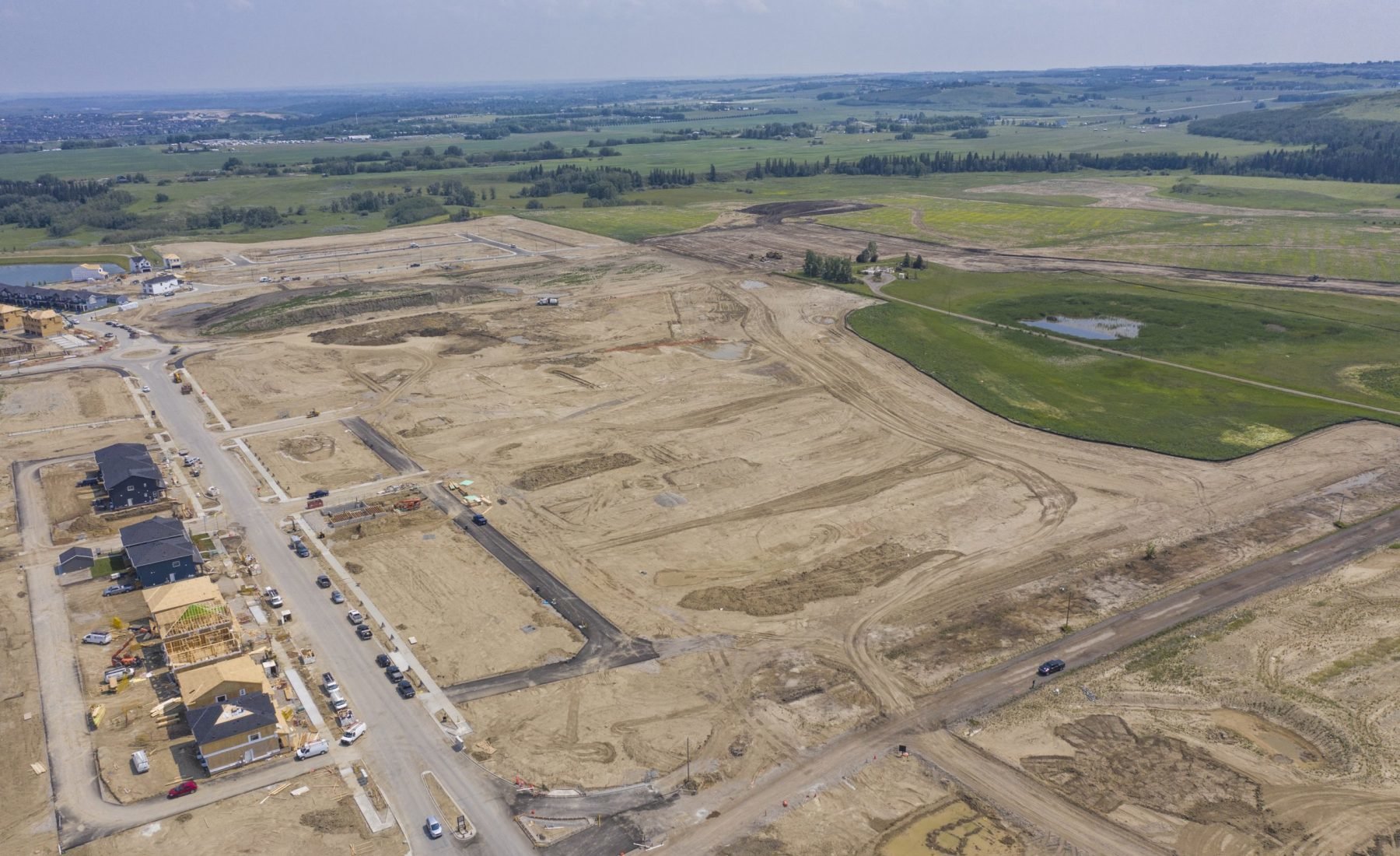 Aerial image of Pine Creek, a new community under construction in SW Calgary AB